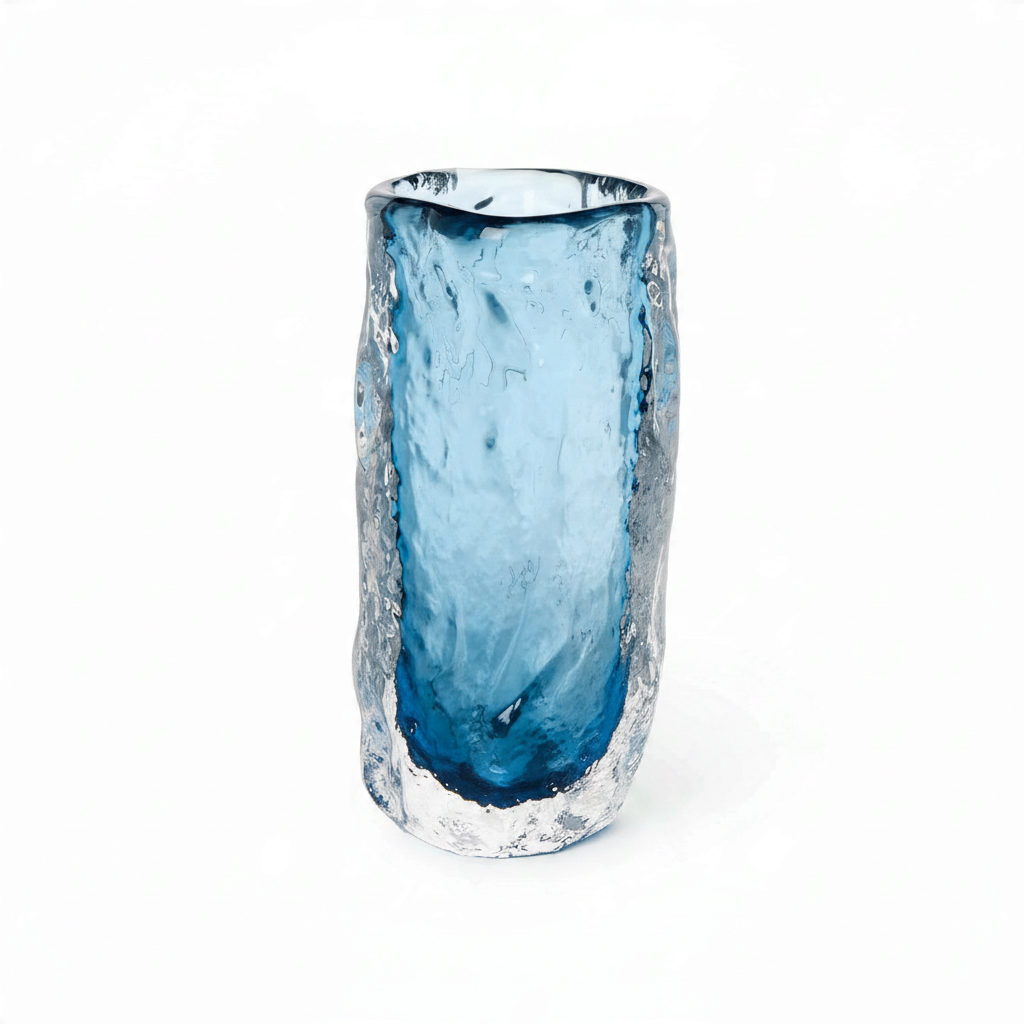 Mellow Monkey hand blown art glass vase featuring a textured clear exterior and a smooth blue interior.