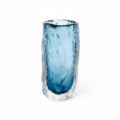 Mellow Monkey hand blown art glass vase featuring a textured clear exterior and a smooth blue interior.