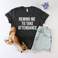 Black t-shirt with 'Remind me to take attendance' text, paired with shorts and shoes on a white background.
