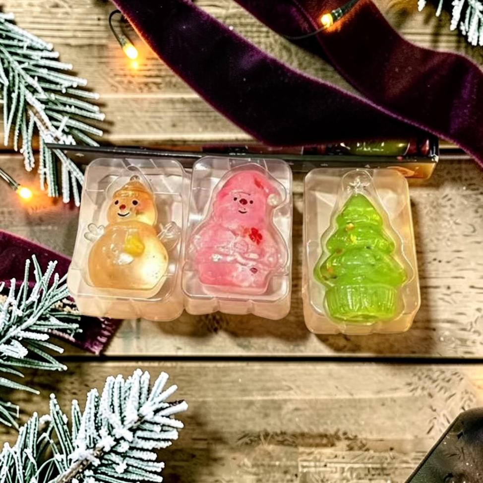 Mellow Monkey Christmas squishy maltose toys featuring a snowman, Santa, and tree in individual clear packaging.