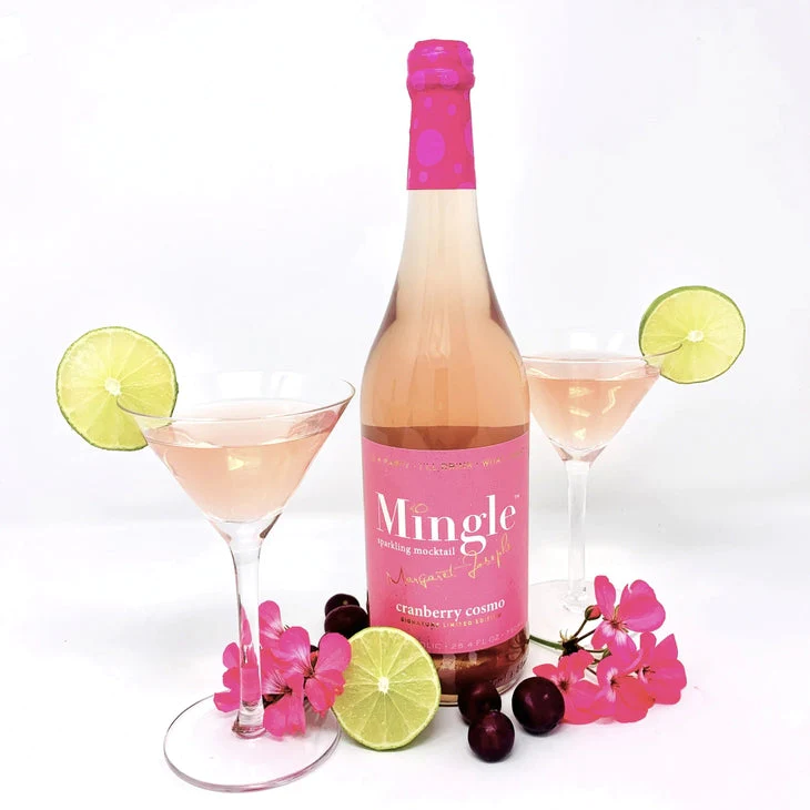 bottle of pink mingle brand cranberry cosmo non-alcoholic beverage with two martini glasses, fruits and florals.