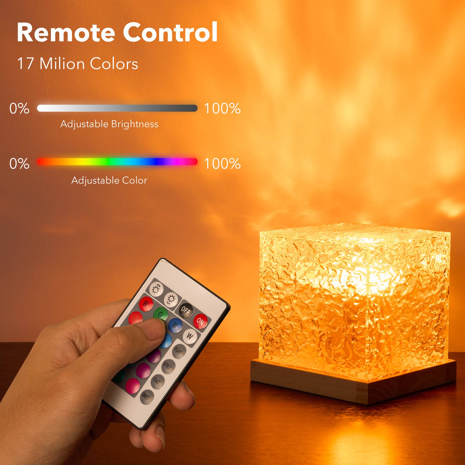 Hand holding a remote control with color and brightness indicators next to a glowing lamp.