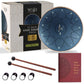12-inch steel tongue drum set with packaging, mallets, and music book on a white background