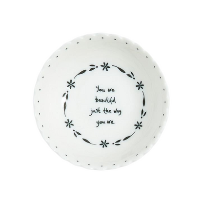 Mellow Monkey set of four white porcelain bowls with scalloped edges and black inspirational quotes and floral motifs