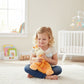 Mellow Monkey orange plush giraffe rattle blankie with striped body and heart detail. Soft, 15-in security blanket for babies.