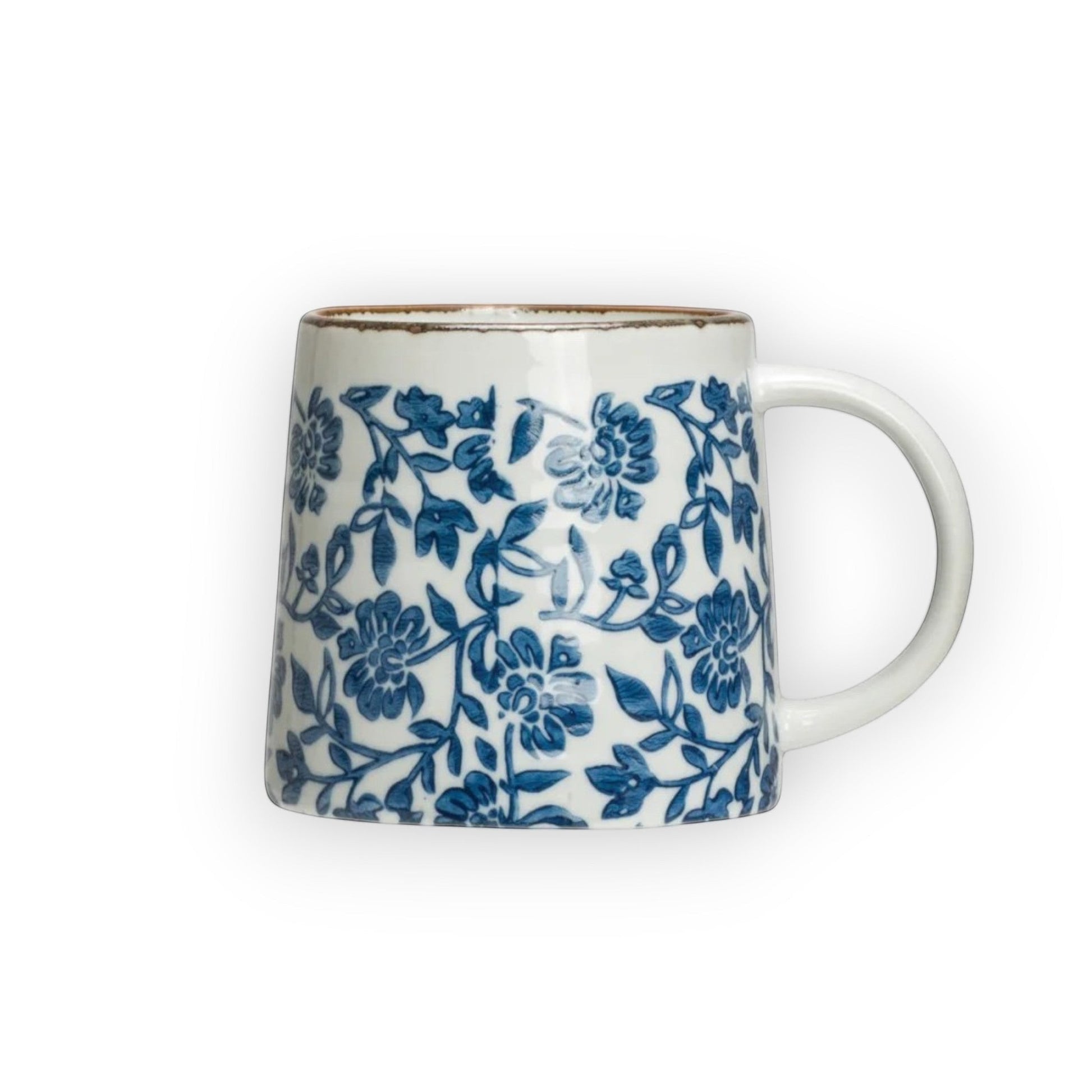 Mellow Monkey hand-stamped stoneware mug with blue floral design and gold rim detail. Microwave, dishwasher, and oven safe.