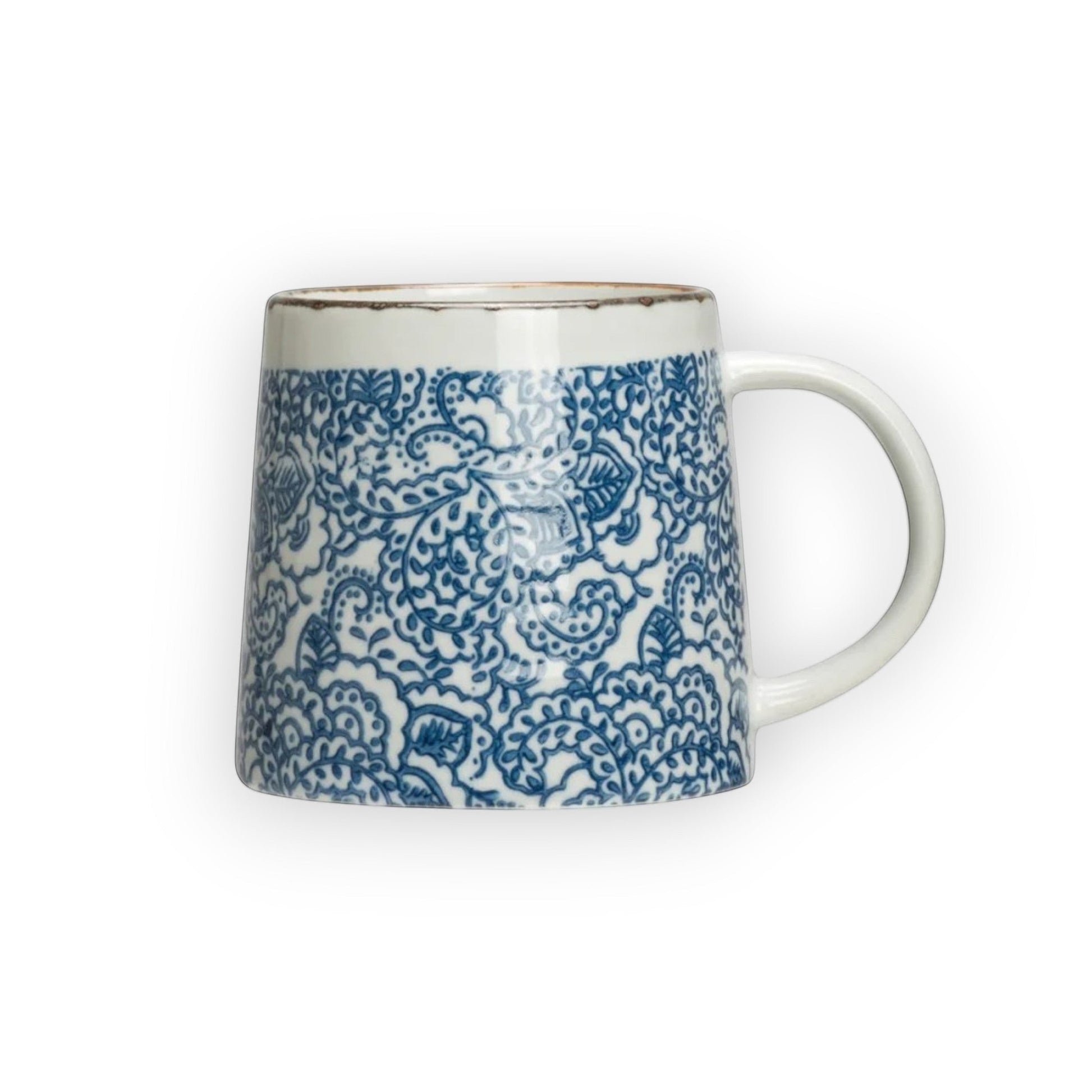 Mellow Monkey hand-stamped stoneware mug with blue floral design and gold rim detail. Microwave, dishwasher, and oven safe.