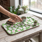 Mellow Monkey small serving tray with green Mahjong tile pattern on a rustic wooden table with tea and glasses