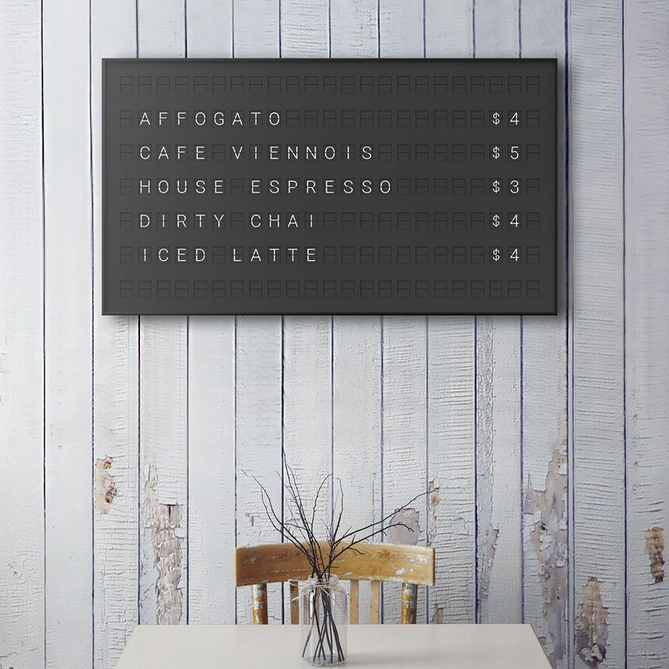 Vestaboard example display. white split flap letters on black background with example drink menu and pricing