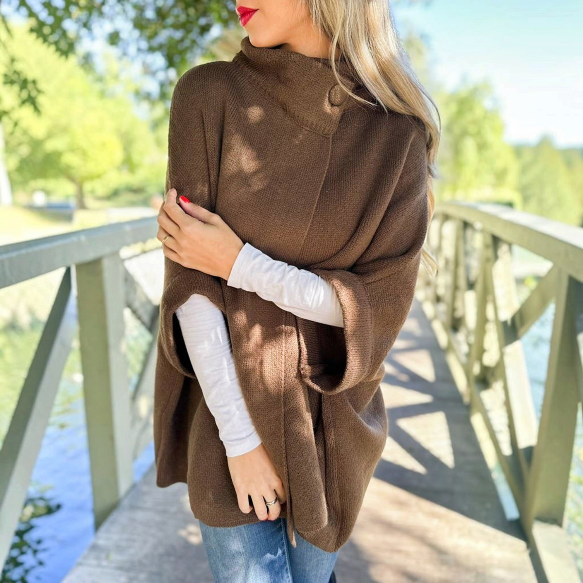 Mellow Monkey dark brown knit cape cardigan with a button neck closure and relaxed silhouette.