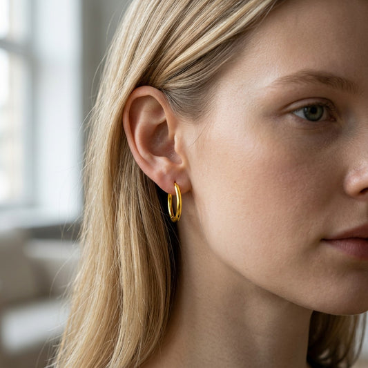 Mellow Monkey 18k gold plated vermeil hoop earrings worn by a blonde woman. Lightweight and sparkly.