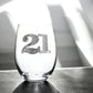 Mellow Monkey 21st birthday stemless wine glass decorated with sparkling silver rhinestones on a dark surface