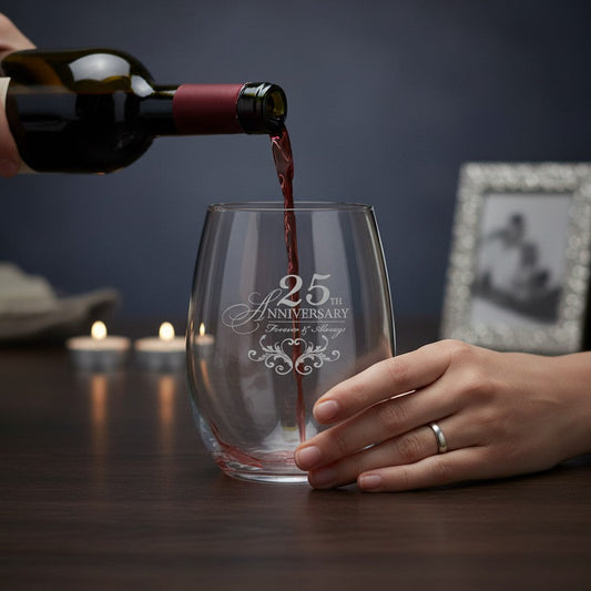 Mellow Monkey 15oz stemless wine glass with silver 25th anniversary engraving being filled with red wine