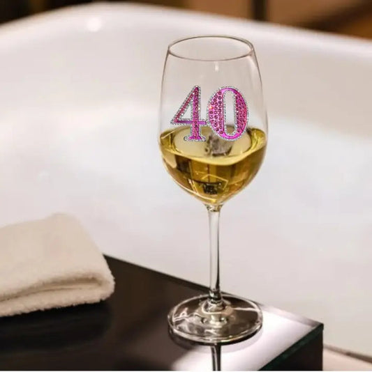 Mellow Monkey 40th birthday wine glass featuring a pink jeweled number 40 design on a clear stemmed glass