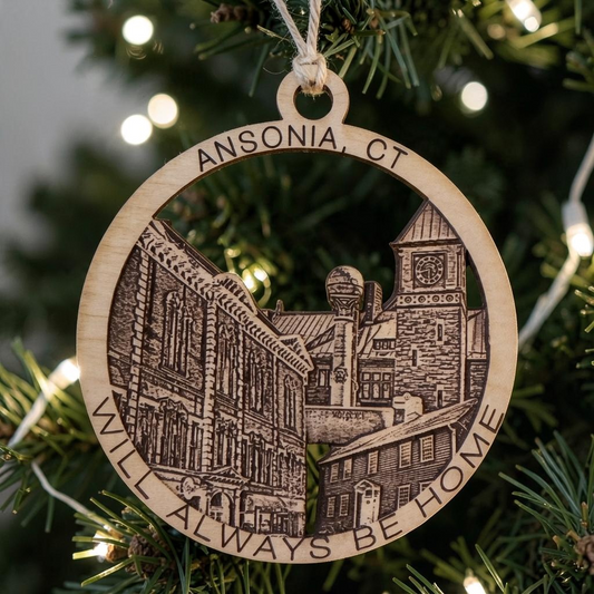 Mellow Monkey 4-inch round wooden ornament featuring laser-engraved Ansonia, CT landmarks hanging on a Christmas tree.