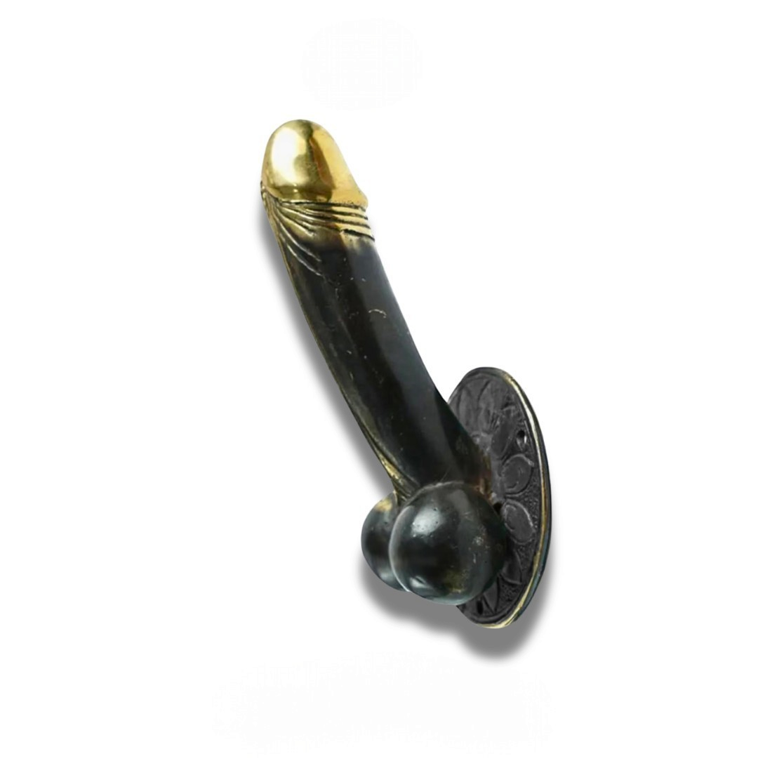 Mellow Monkey 8-inch antique brass wall hook with a bold, sculptural design and dark patina finish.