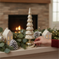 Mellow Monkey antique gold rotating LED glass tree centerpiece on a mantel with festive holiday decor