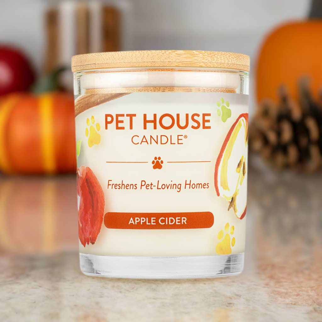 Mellow Monkey Pet House Apple Cider scented candle in a glass jar with a wooden lid, designed to neutralize pet odors.