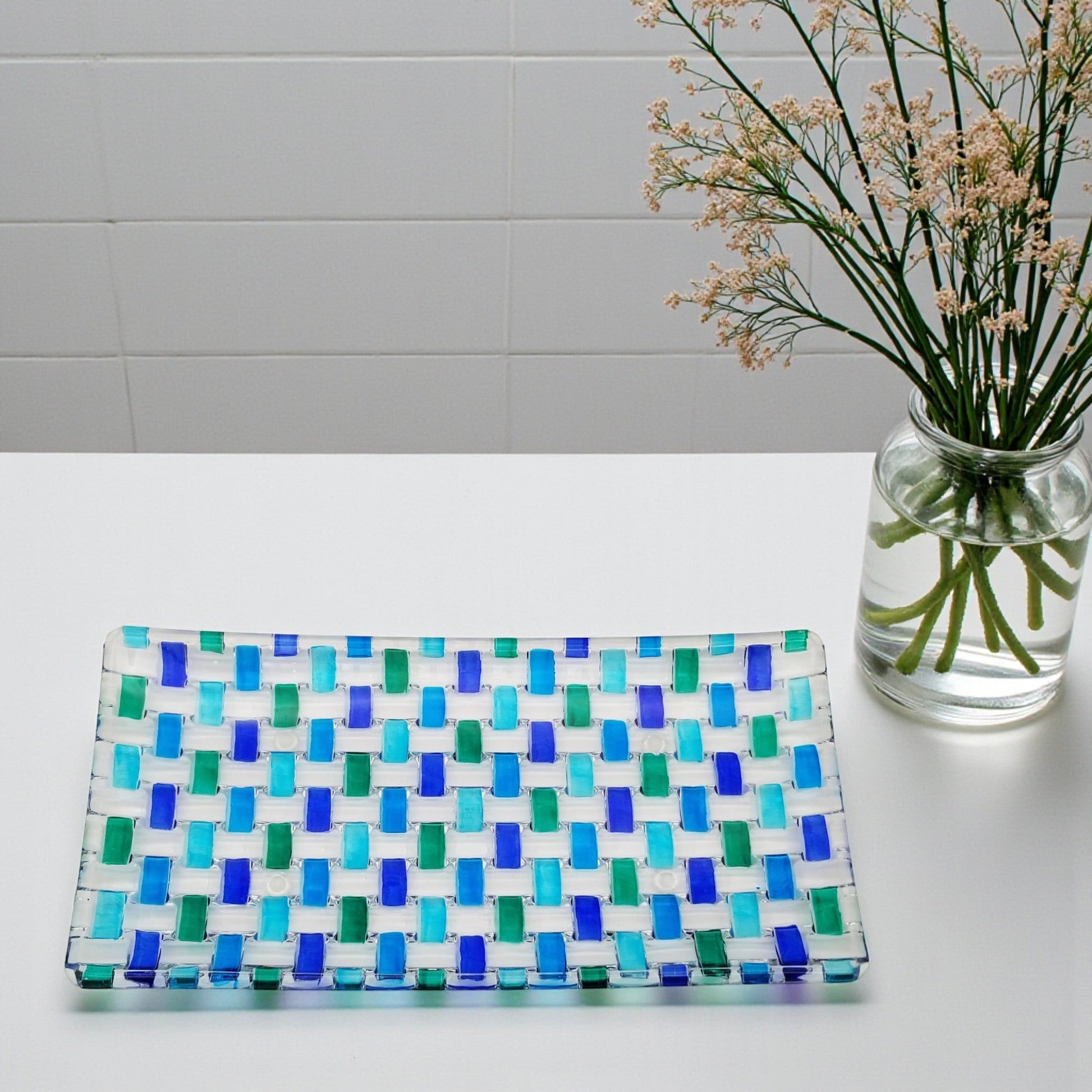 Mellow Monkey Aqua Bossanova 11-inch serving tray made of hand-painted Venetian glass in blue and green woven pattern.