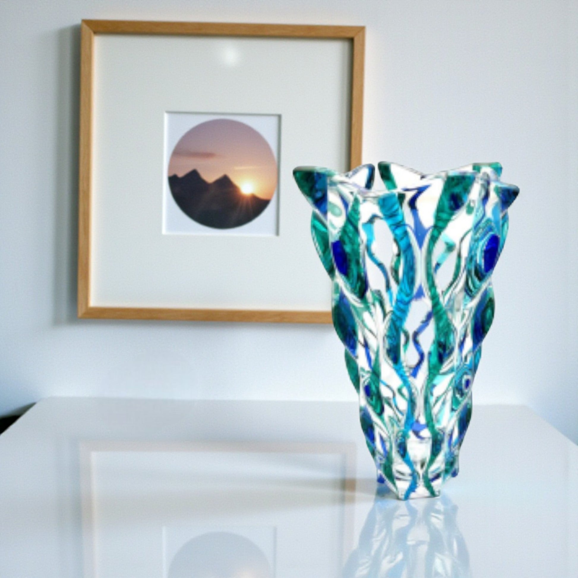 Mellow Monkey Aqua Samba 12-inch hand-painted Venetian glass vase in blue and green with a swirling pattern.