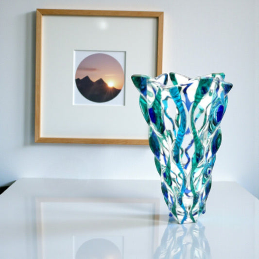 Mellow Monkey Aqua Samba 12-inch hand-painted Venetian glass vase in blue and green with a swirling pattern.