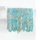 Mellow Monkey aqua seaglass stretch seed bead bracelets with 18k gold plated accents on a display stand.