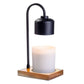 Mellow Monkey arched candle warmer lamp with a black matte metal stem and a natural wood base holding a jar candle.