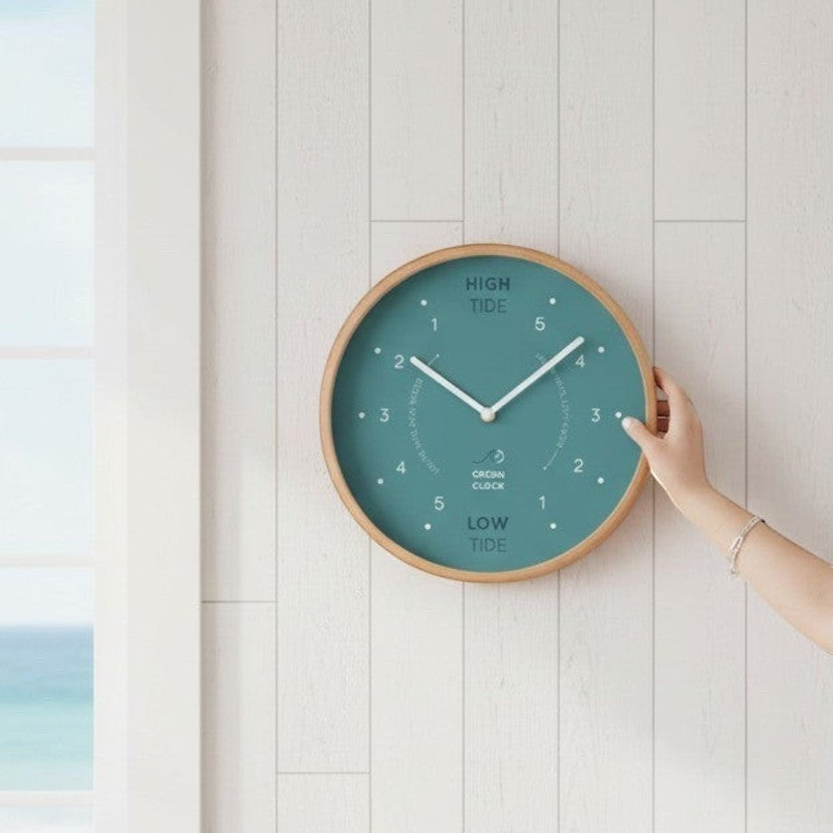 Mellow Monkey Arctic Turquoise Wooden Tide Clock with beech frame, white hands, and mineral glass face. Measures 12-in diameter.