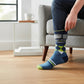 Mellow Monkey crew socks featuring an argyle pattern and the text How May I Offend You Today? worn by a person.
