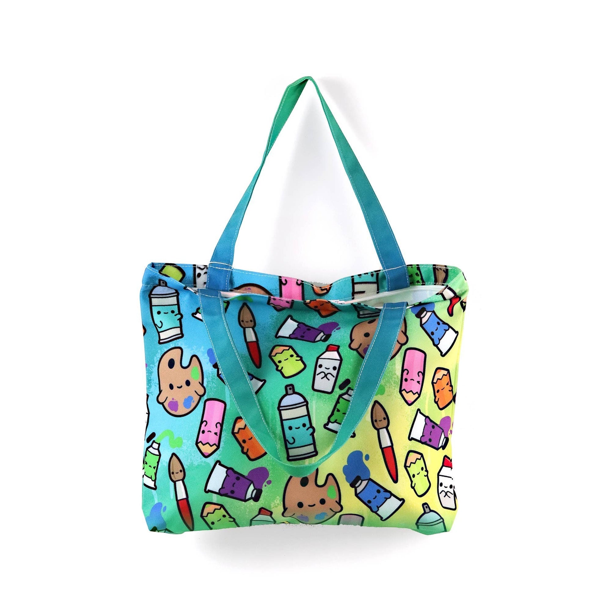 Mellow Monkey art supplies tote bag with colorful cartoon paint tubes, spray cans, and brushes on a gradient background. Features dual straps and a zippered closure.