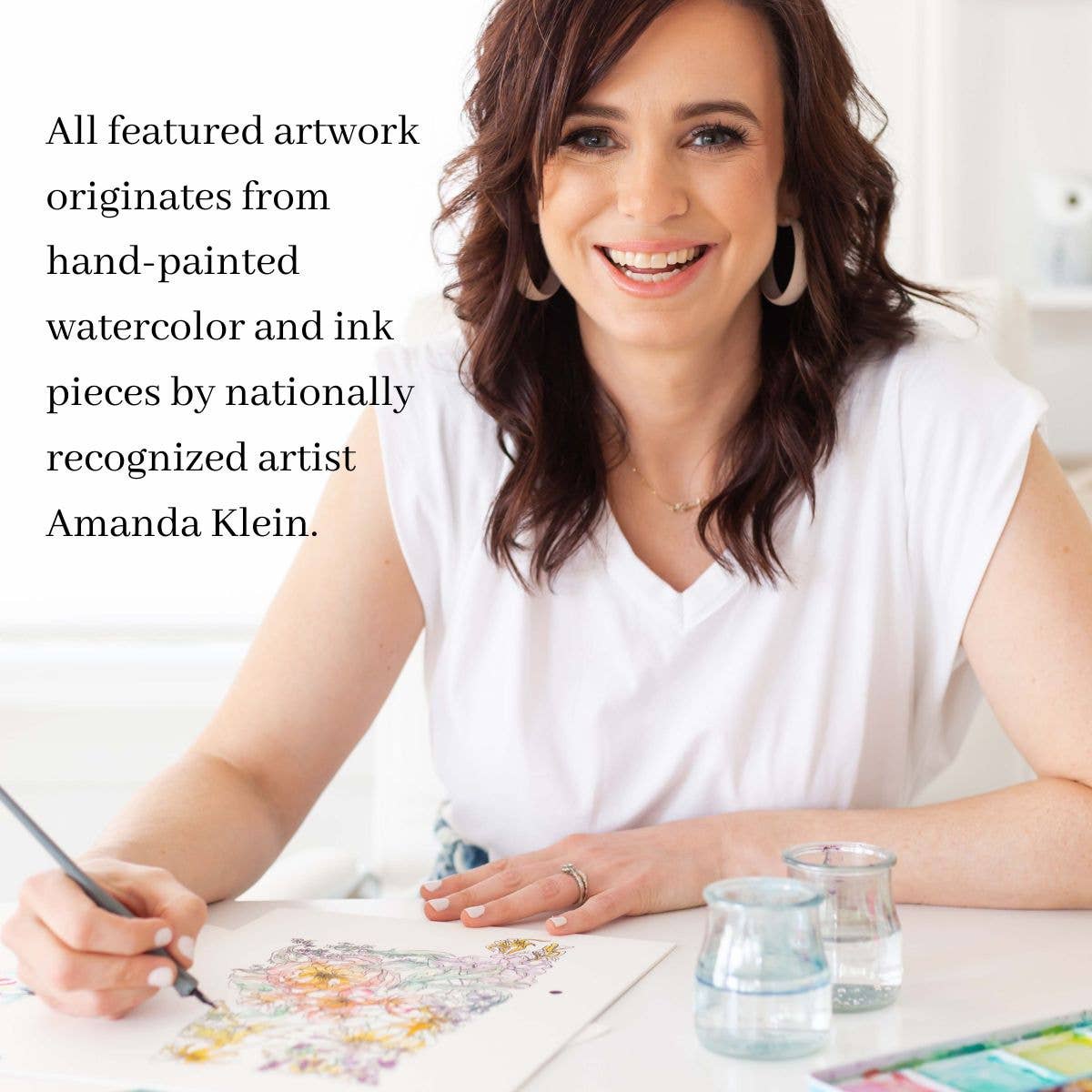 Mellow Monkey artist Amanda Klein painting a floral design for a plantable wildflower greeting card