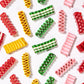 Mellow Monkey assorted colorful ribbon candies in peppermint, clove, cherry, cinnamon, and lemon flavors.