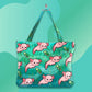 Mellow Monkey pink axolotl and green turtle print tote bag with dual straps and zippered closure.
