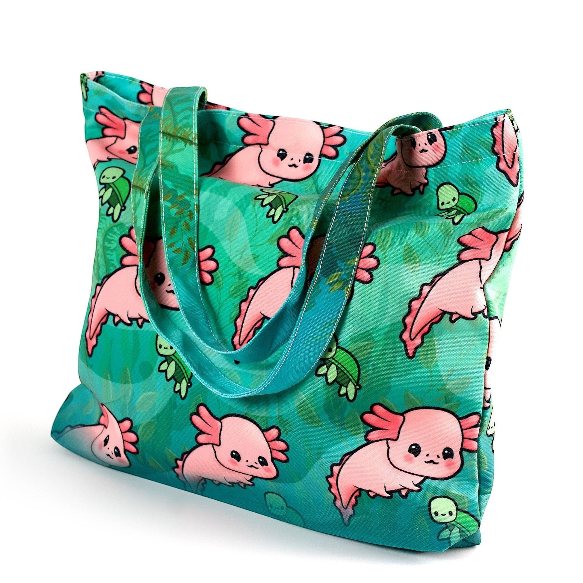 Mellow Monkey teal tote bag with a cute pink axolotl and green turtle print, canvas-like material, dual straps, and zippered closure.
