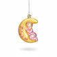 Mellow Monkey Dreamtime Girl blown glass ornament featuring a baby sleeping on a yellow crescent moon