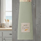 Mellow Monkey Baking Queen kitchen boa with a pastel baking-themed print and a light green waffle-weave towel.