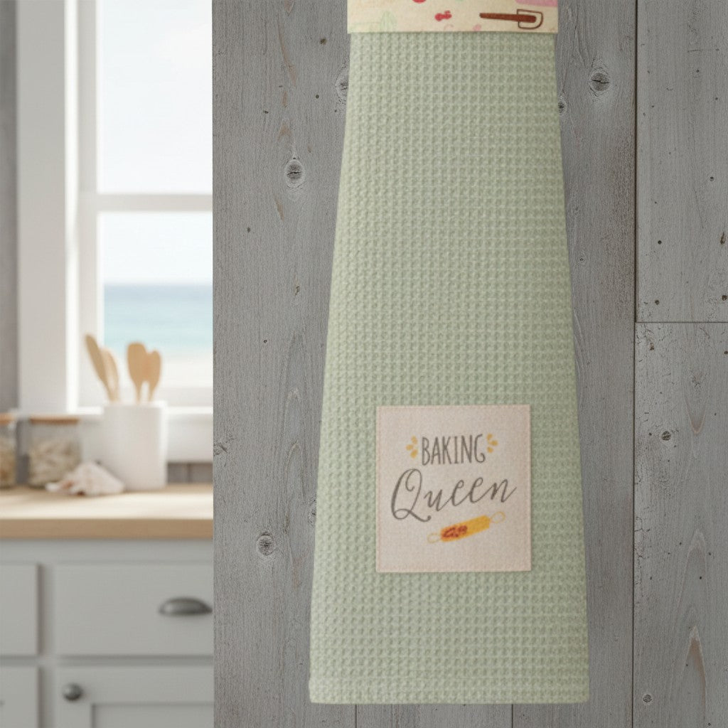 Mellow Monkey Baking Queen kitchen boa with a pastel baking-themed print and a light green waffle-weave towel.