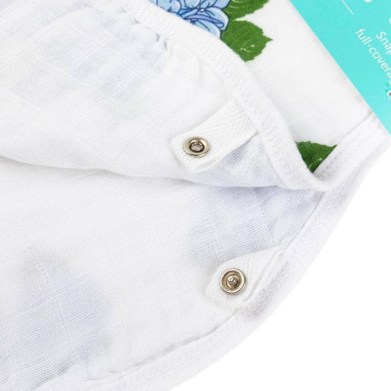 Mellow Monkey 2-in-1 baby burp cloth and bib featuring a white bamboo and cotton muslin fabric with snap closures