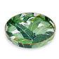 Mellow Monkey banana leaf print round resin serving tray with gold trim and handles.
