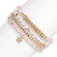 Mellow Monkey bracelet set featuring freshwater baroque pearls, pink crystals, gold chain, and a star charm.