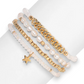 Mellow Monkey baroque pearl and ice white crystal bracelet set with 14K gold-plated star charm on a wrist