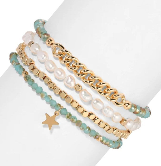 Mellow Monkey bracelet set featuring freshwater baroque pearls, gold chain links, and sea-green crystal beads.