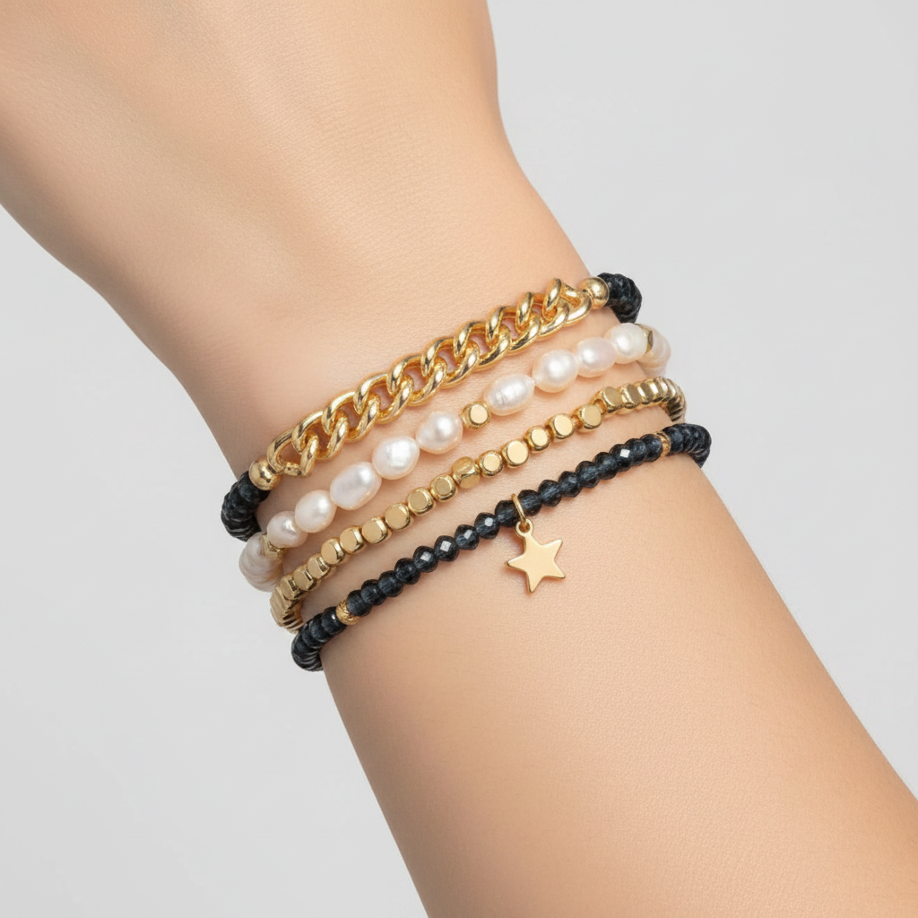 Mellow Monkey bracelet set featuring baroque freshwater pearls, indigo crystals, gold chain, and a star charm.