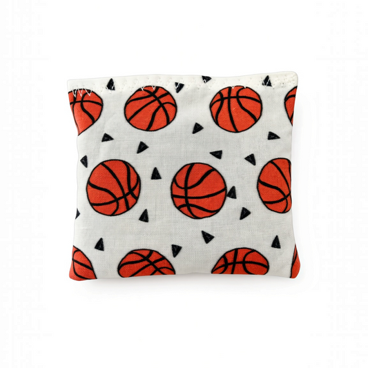 Mellow Monkey Mantra Beads sensory calm bag featuring a white fabric with an orange basketball and black triangle print