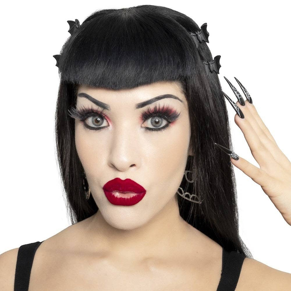 Model wearing Mellow Monkey black bat mini claw clips in her dark hair for a gothic aesthetic.