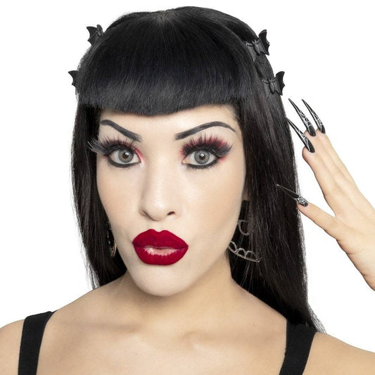 Model wearing Mellow Monkey black bat mini claw clips in her dark hair for a gothic aesthetic.