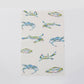 Mellow Monkey Bay Blues microfiber tea towel with a pattern of blue crabs and Kim Hovell art. 16x24 inches.
