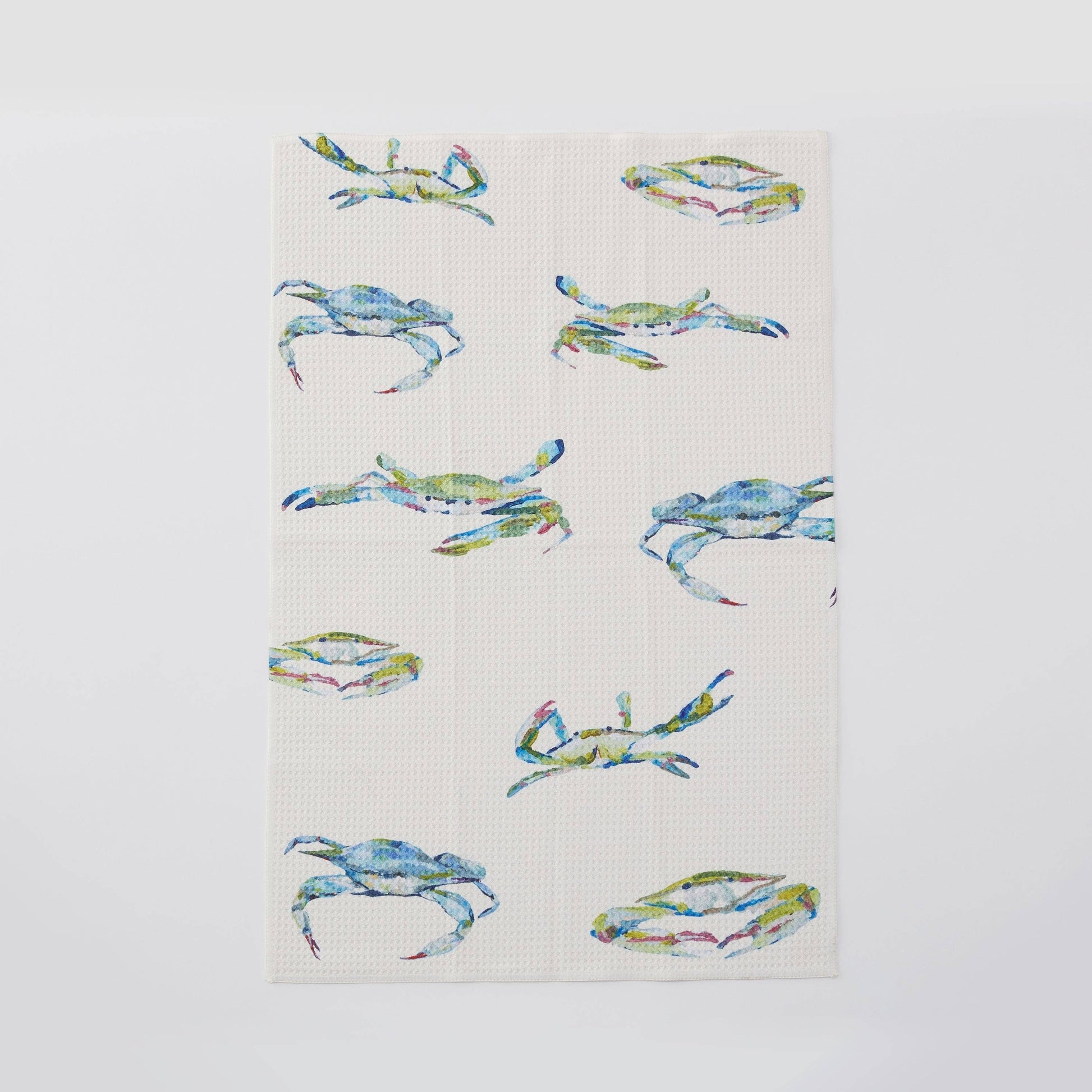 Mellow Monkey Bay Blues microfiber tea towel with a pattern of blue crabs and Kim Hovell art. 16x24 inches.