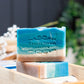 Mellow Monkey Beach Haven Summer handmade soap bar with blue ocean waves and tan sand layers. 4-oz.