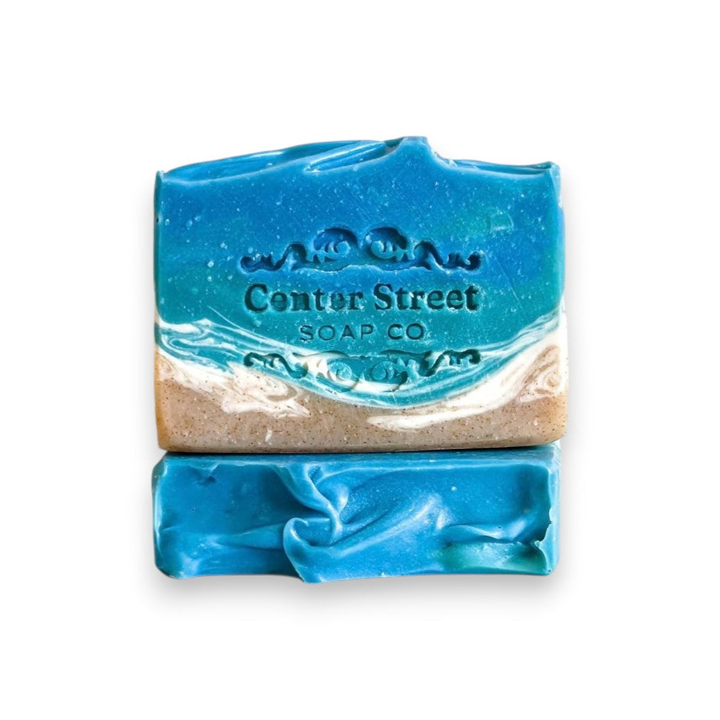 Mellow Monkey Beach Haven Summer handmade soap bar with blue ocean waves and sandy beach design. 4-oz.